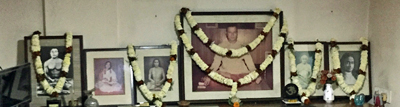 Garlands around the portraits of the lineage.