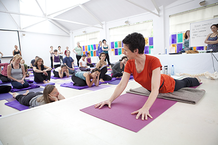 Donna Farhi teaches alignment principles in a yoga class